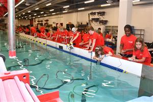 SeaPerch students at hydro-lab at USNA manuvering ROVS